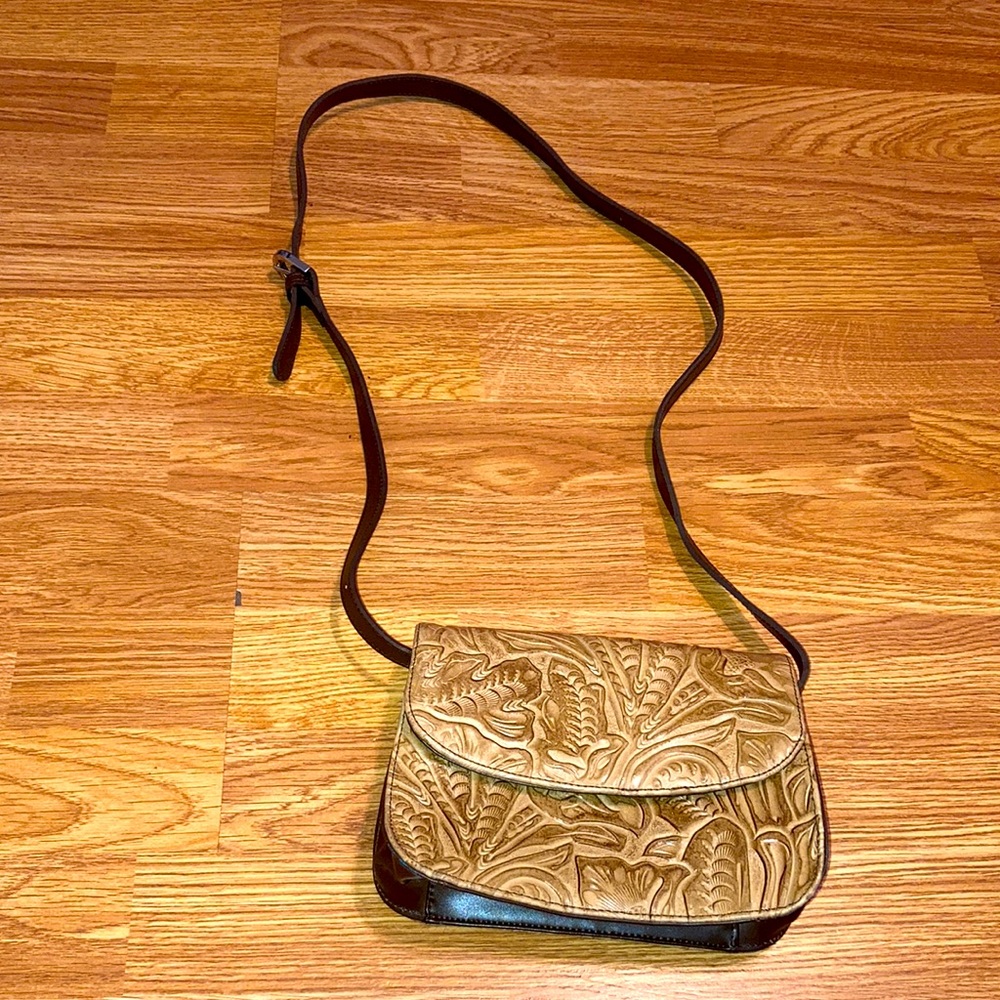 Q&A Tooled carved handbag